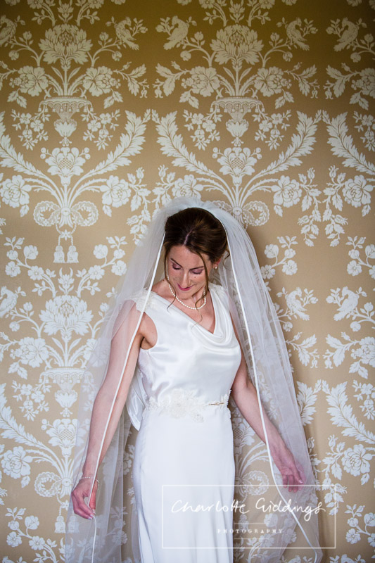 portrait of bride in wedding suite at soulton hall