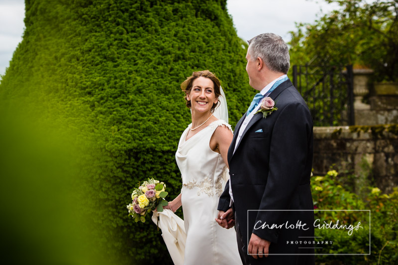 candid photo of bride with groom soulton hall