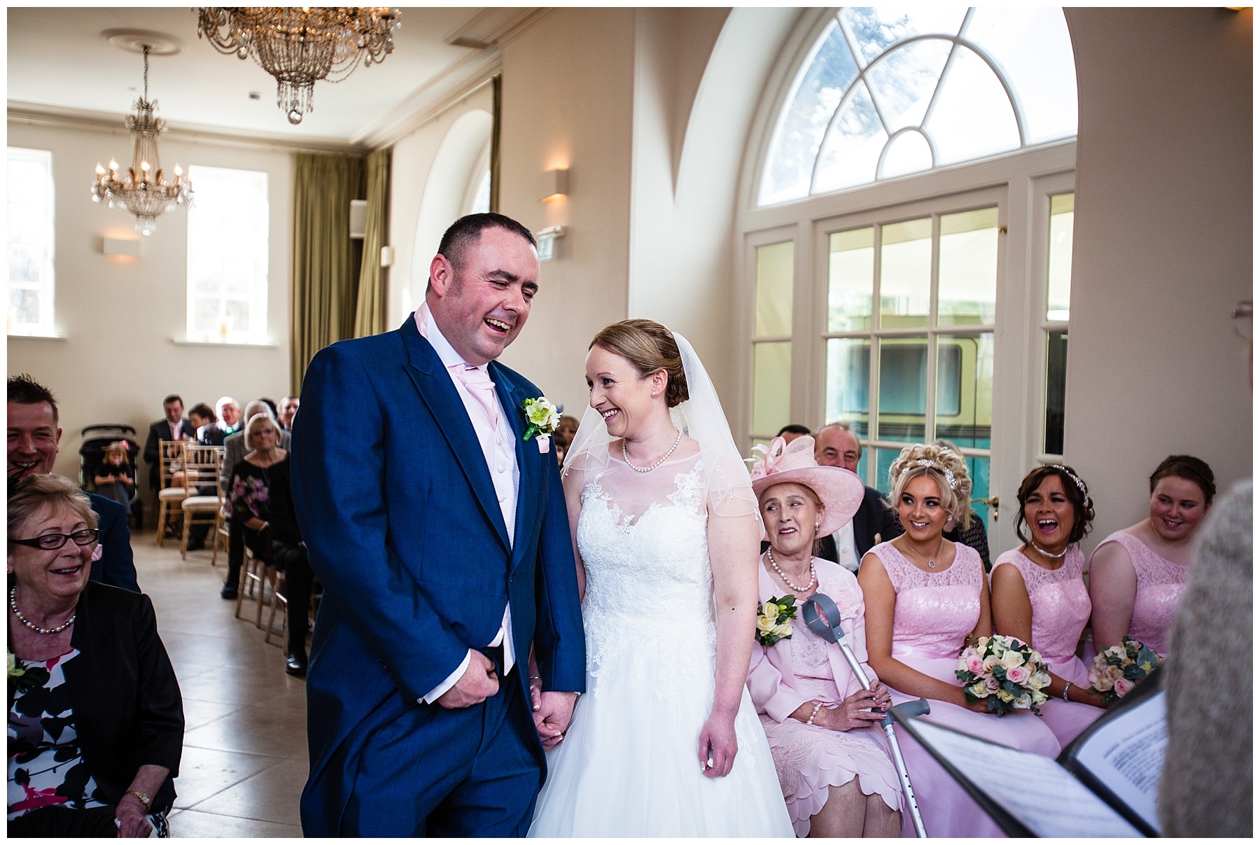 bride and groom laughing out loud during their iscoyd park ceremony at their winter wedding