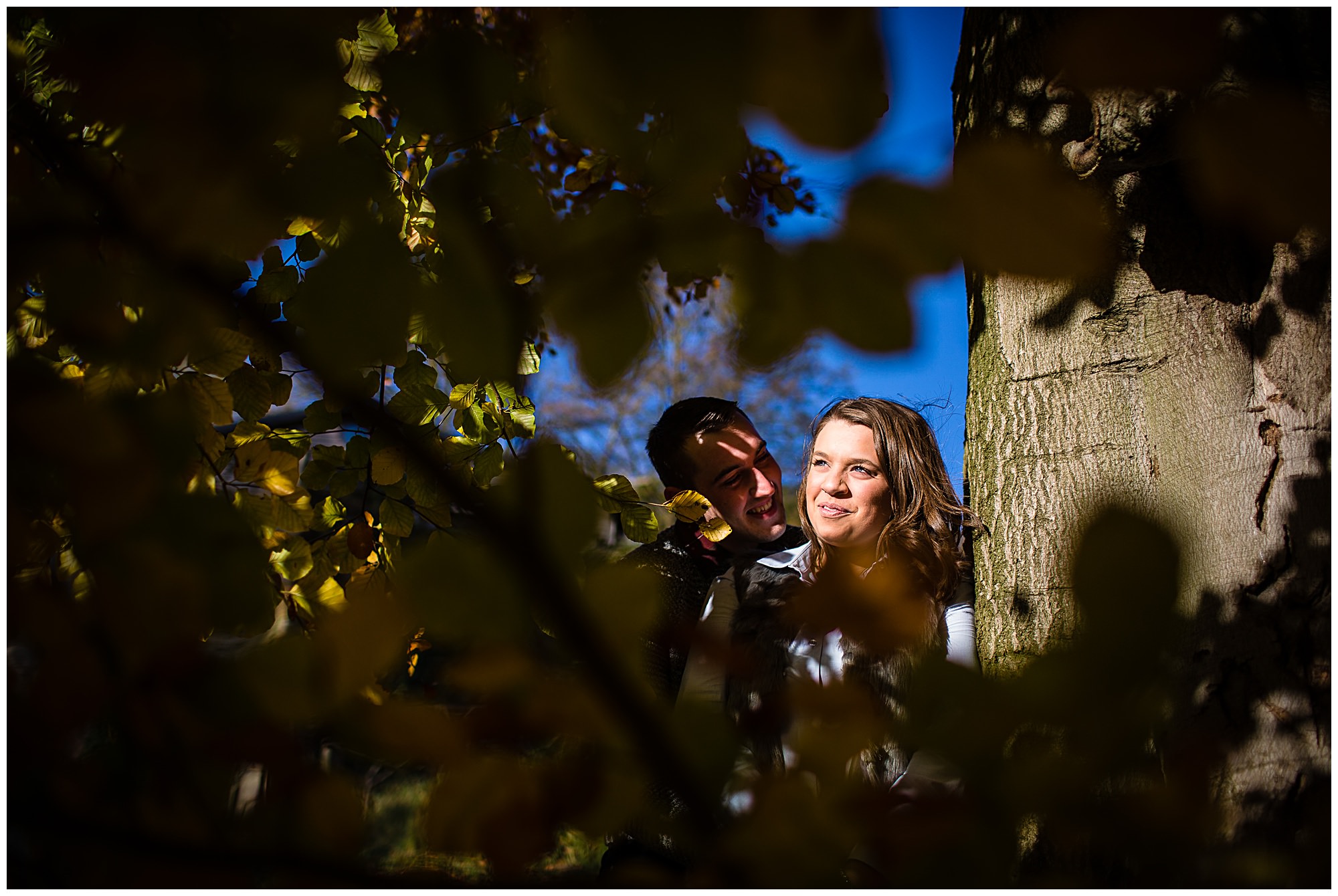 Kirsty and Luke in warm sunshine and autumn leaves - Shropshire Engagement Photographer