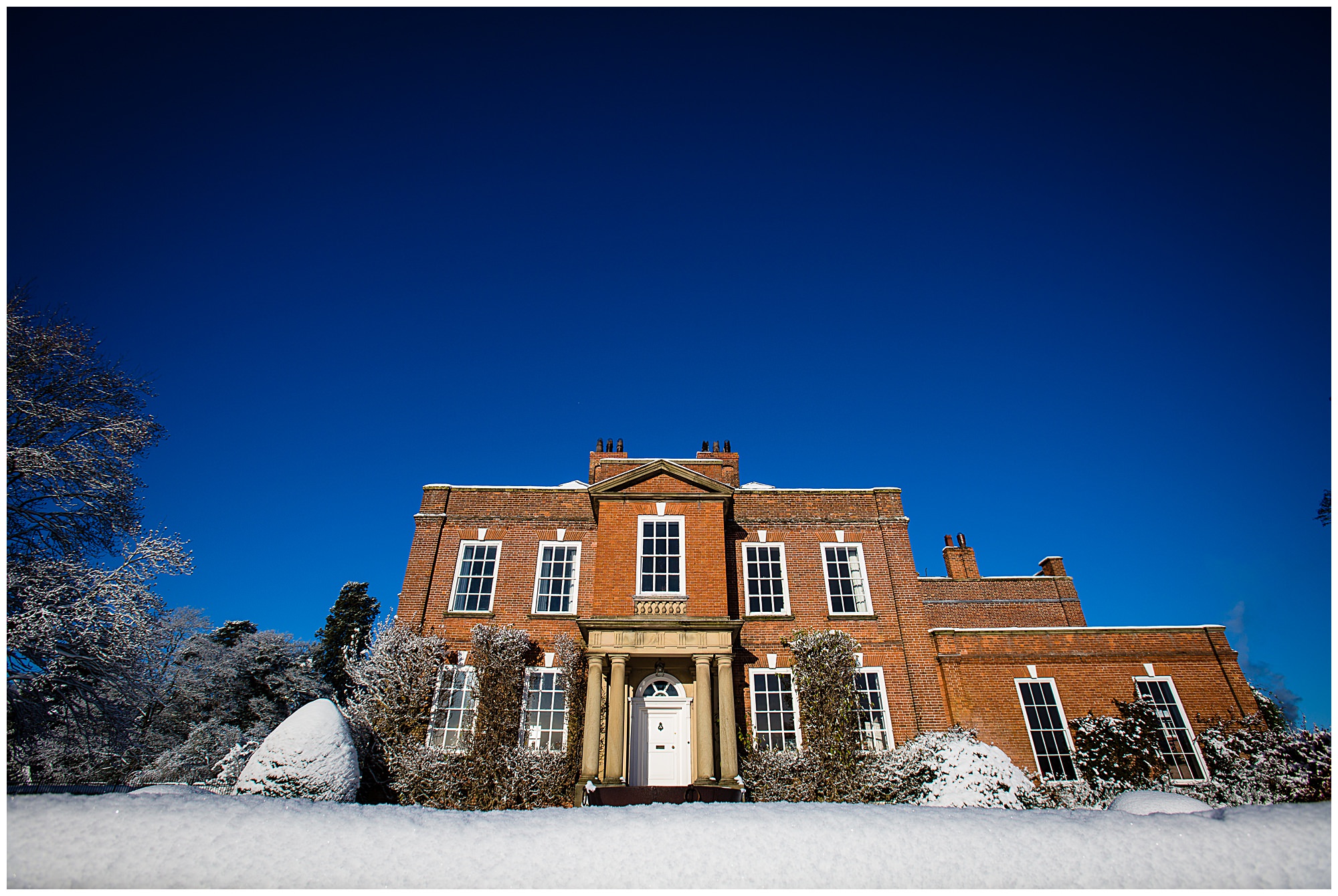 a snowy iscoyd park with blue sky