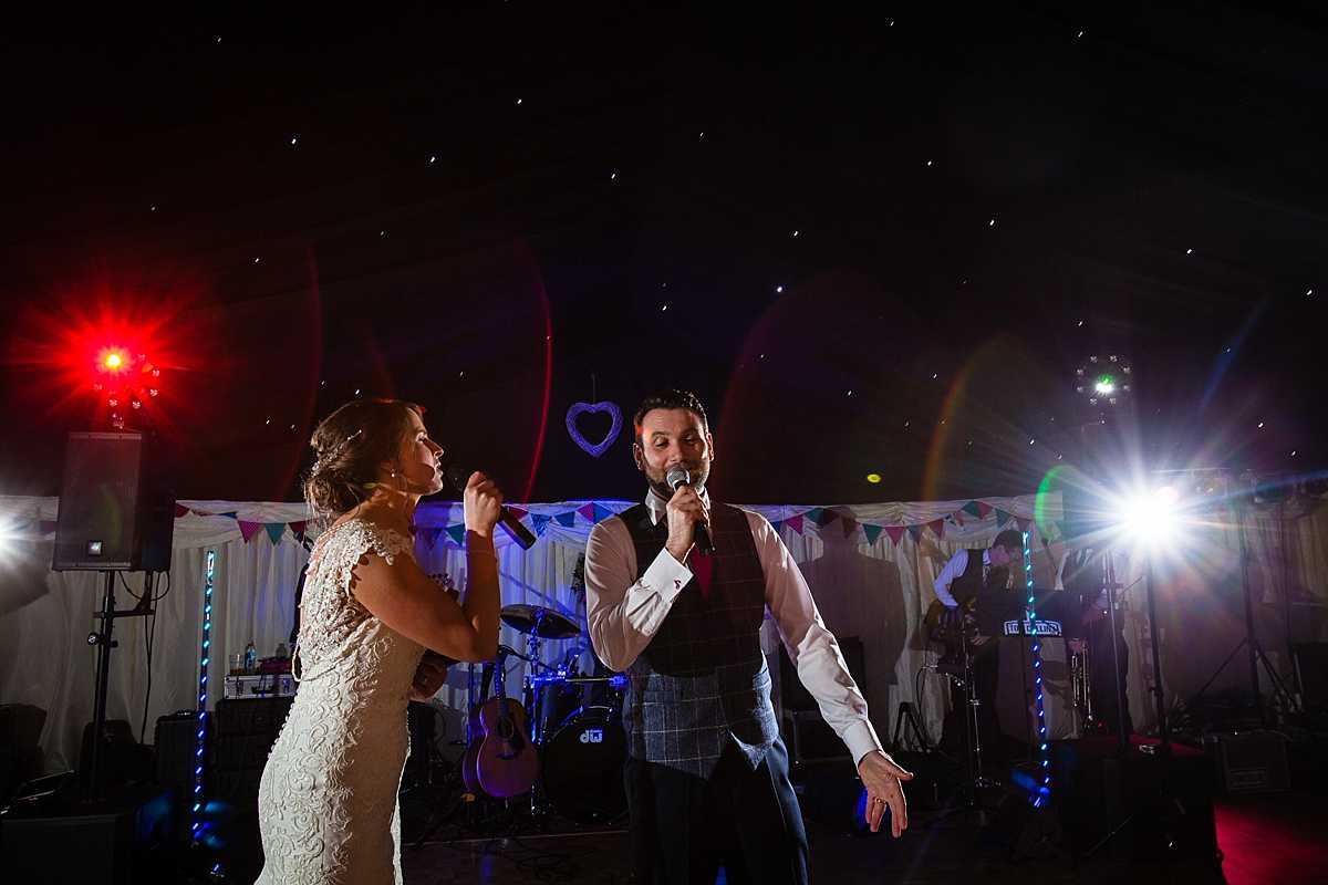 bride and groom in full song together during their first dance