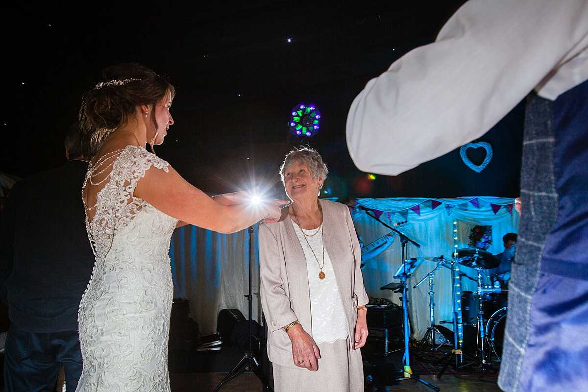 the bride dancing with an older family member who is looking adoringly at her