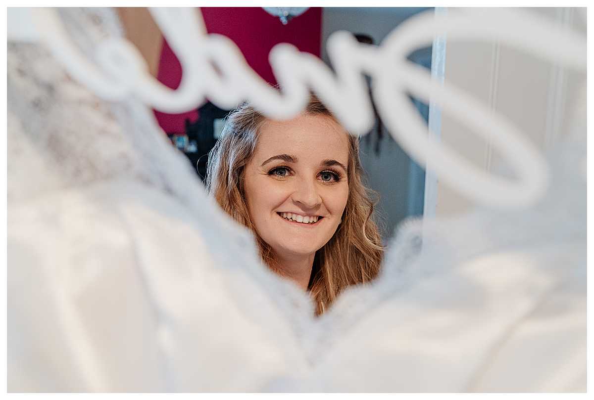 bride excited to put her wedding dress on, wedding photographer shropshire