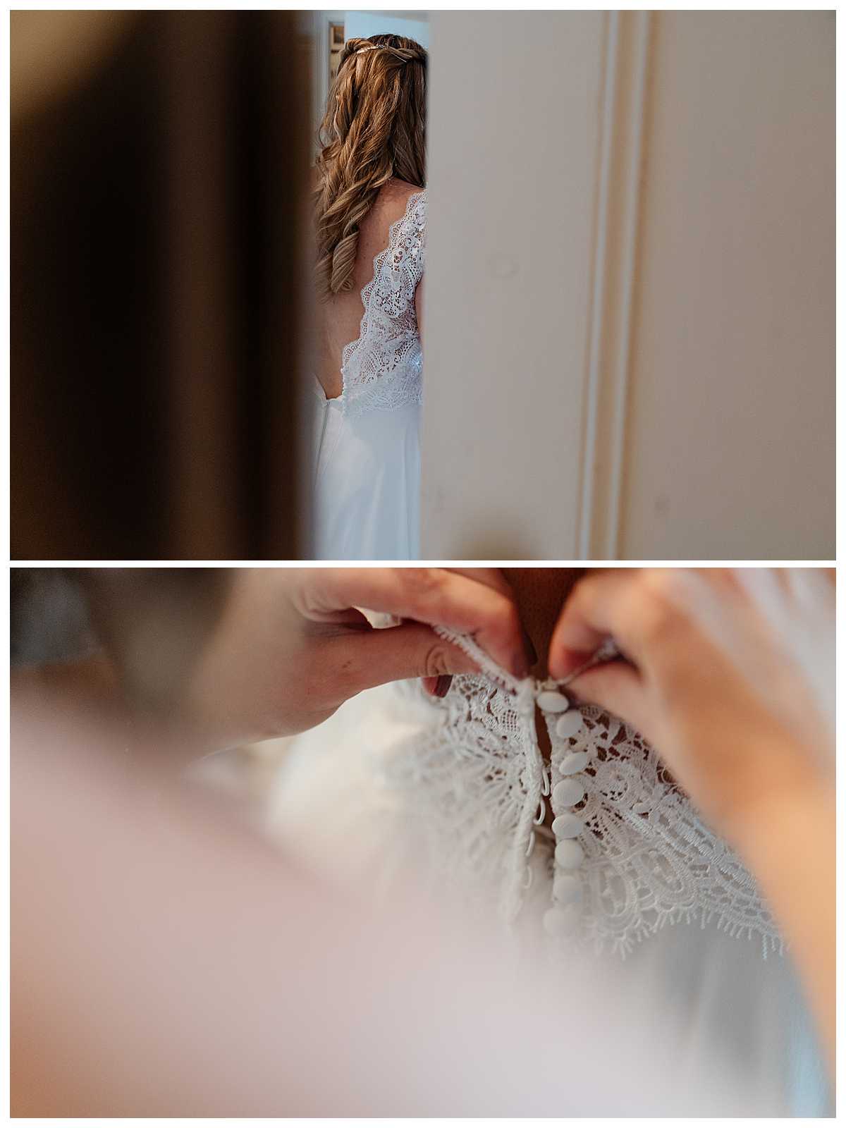 finishing touches, doing buttons up on wedding dress, charlotte giddings photography