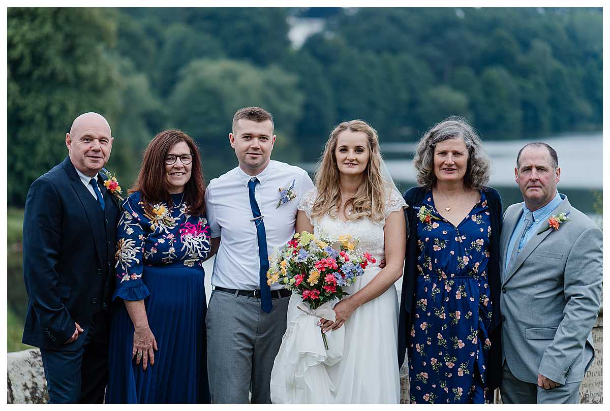bride and groom with parents at marbury church wedding, shropshire