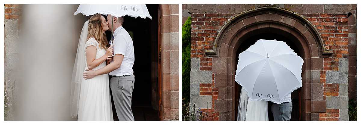 bride and groom standing in church door way kissing under an umbrella - charlotte giddings photography