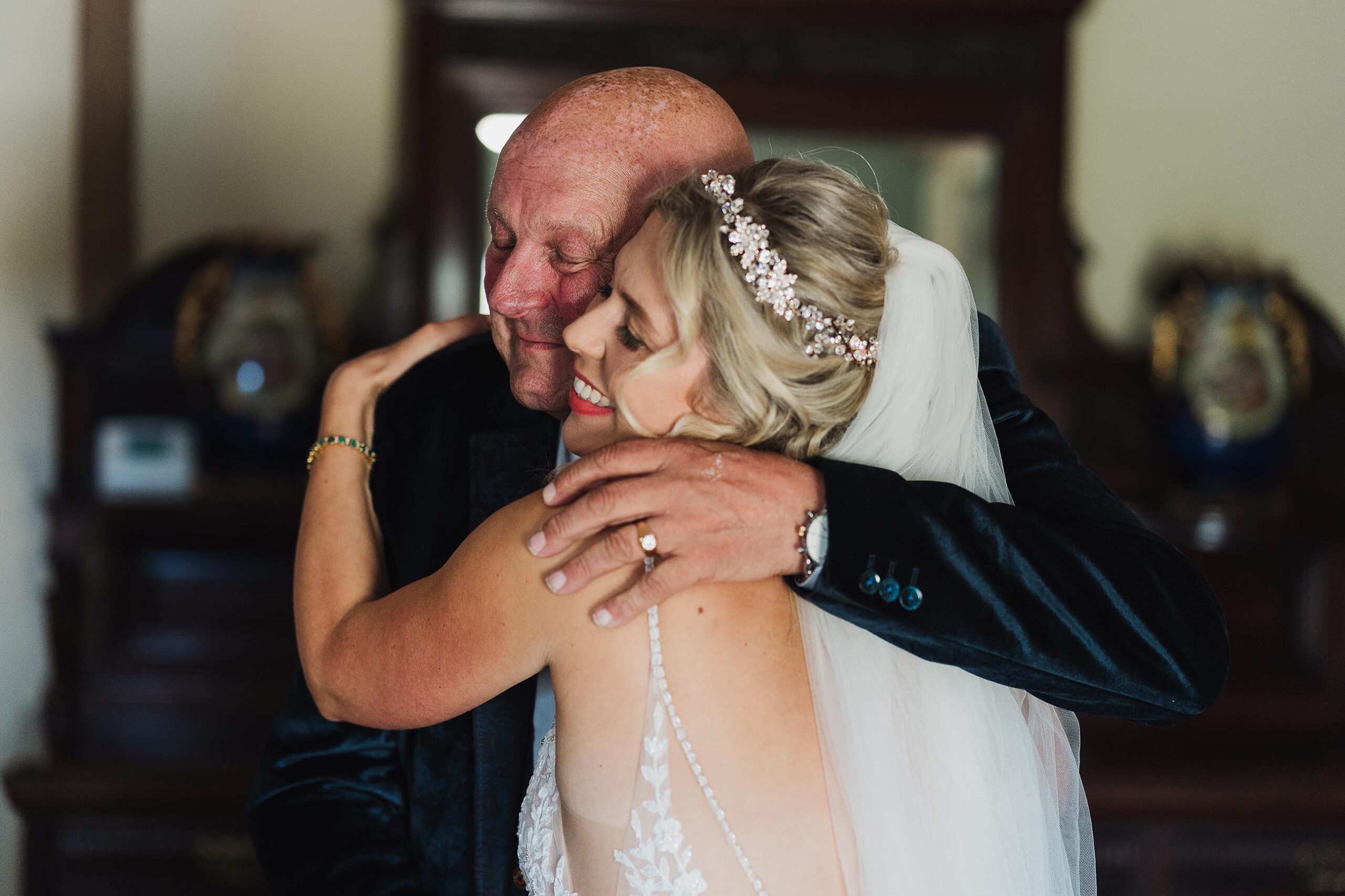 Father giving his daughter the biggest proudest hug on her wedding day