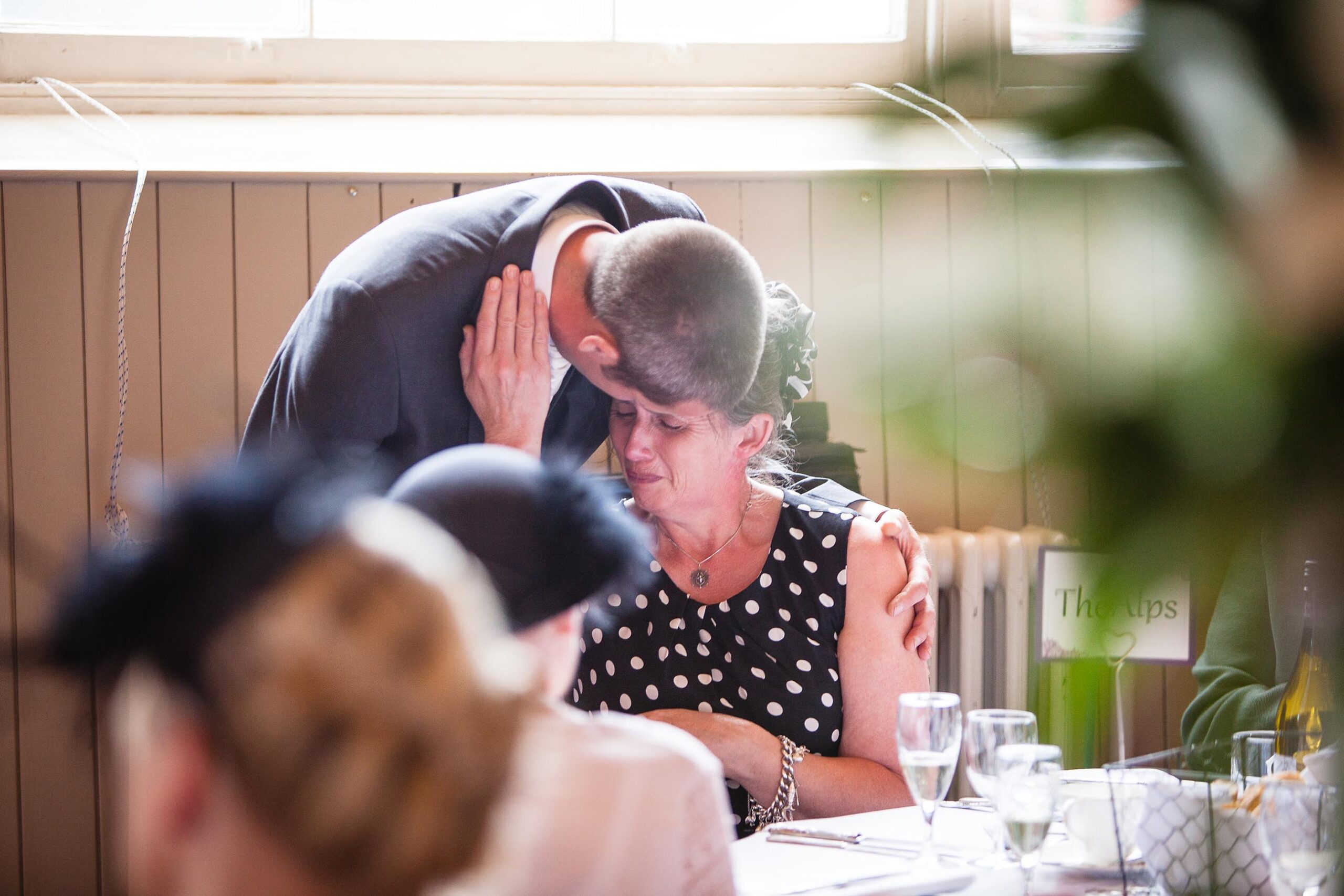 groom embracing his mum after an emotional speech at Montgomery Town Hall, Charlotte Giddings Photography