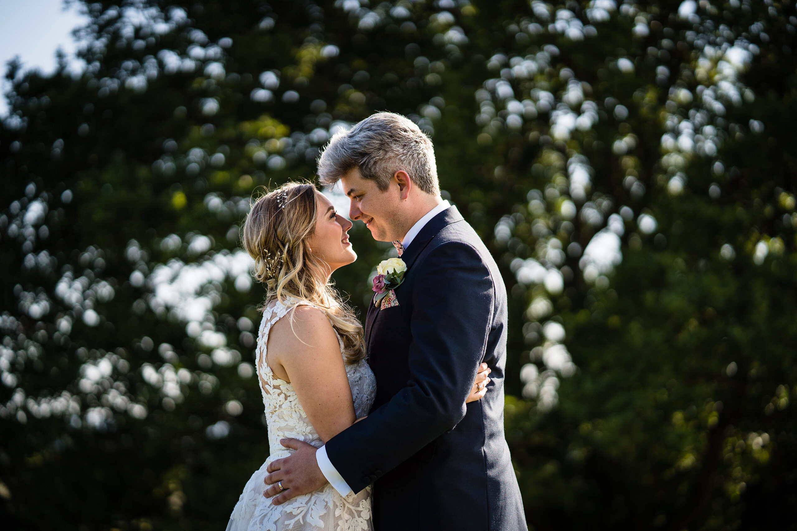 bride and groom having a kiss in golden hour at hencote vineyard, shrewsbury