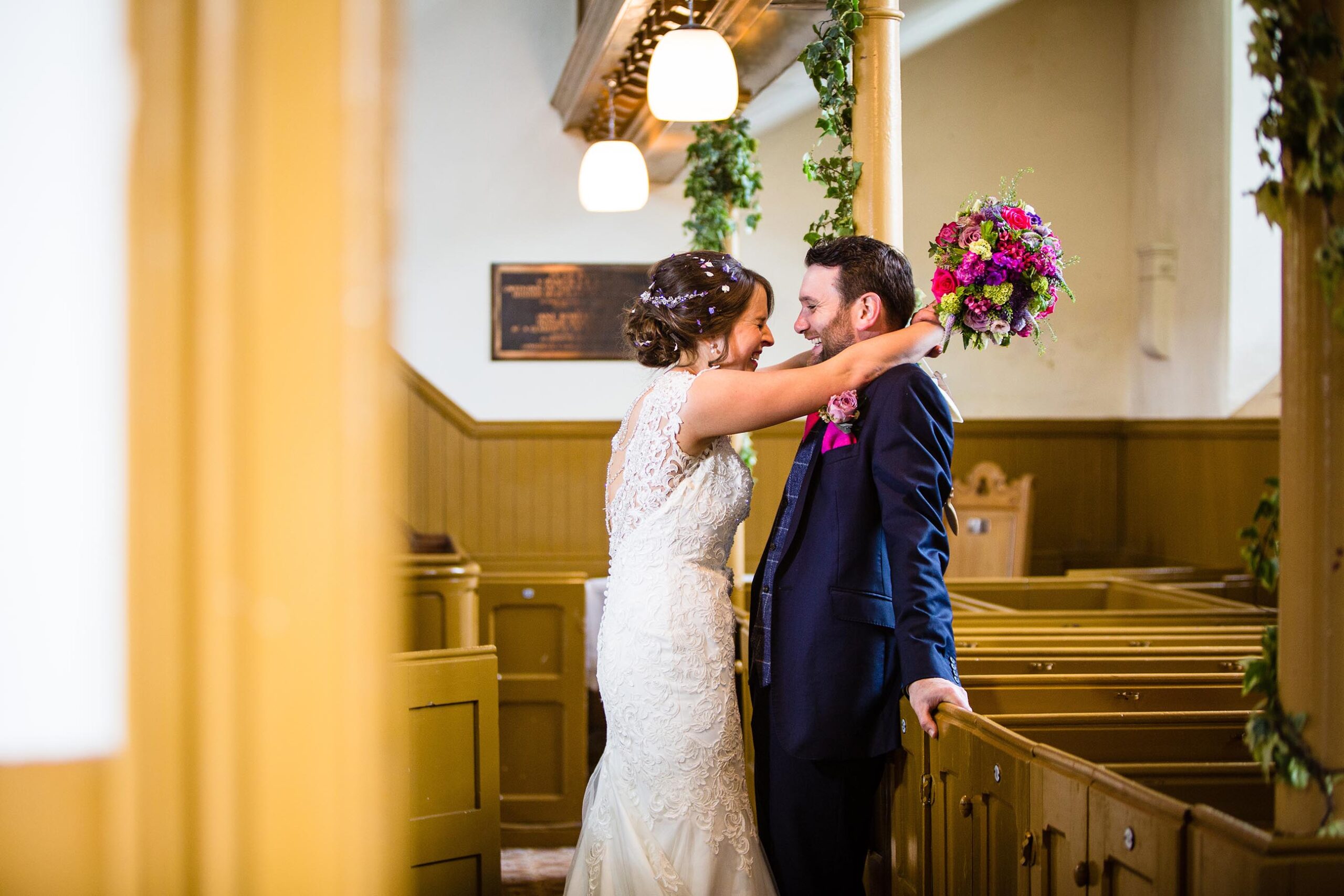 Machynlleth church wedding, bride and groom giggling between themselves