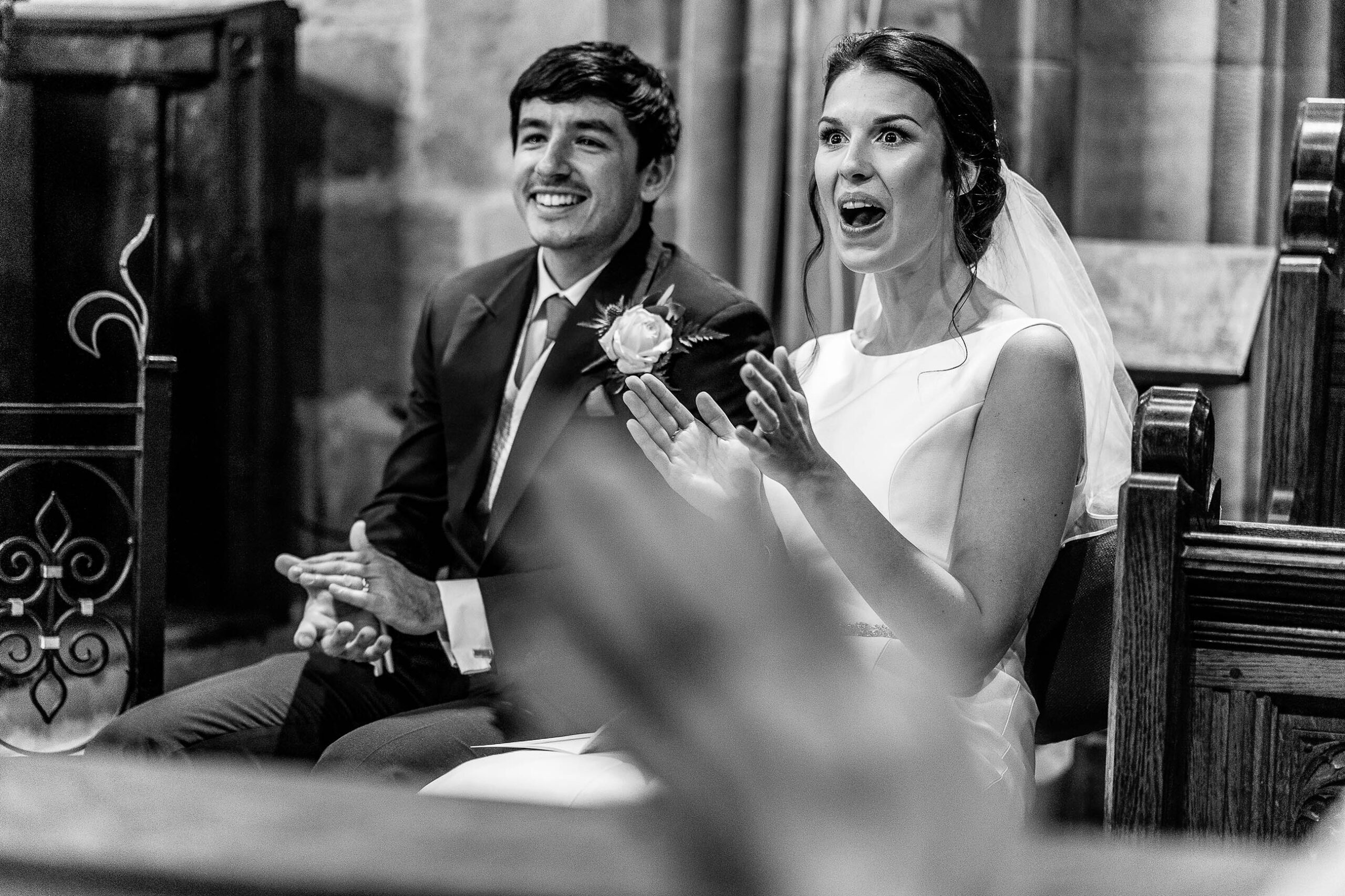 Bride looking shocked at reading in church, St Michael's Church, Marbury Cheshire