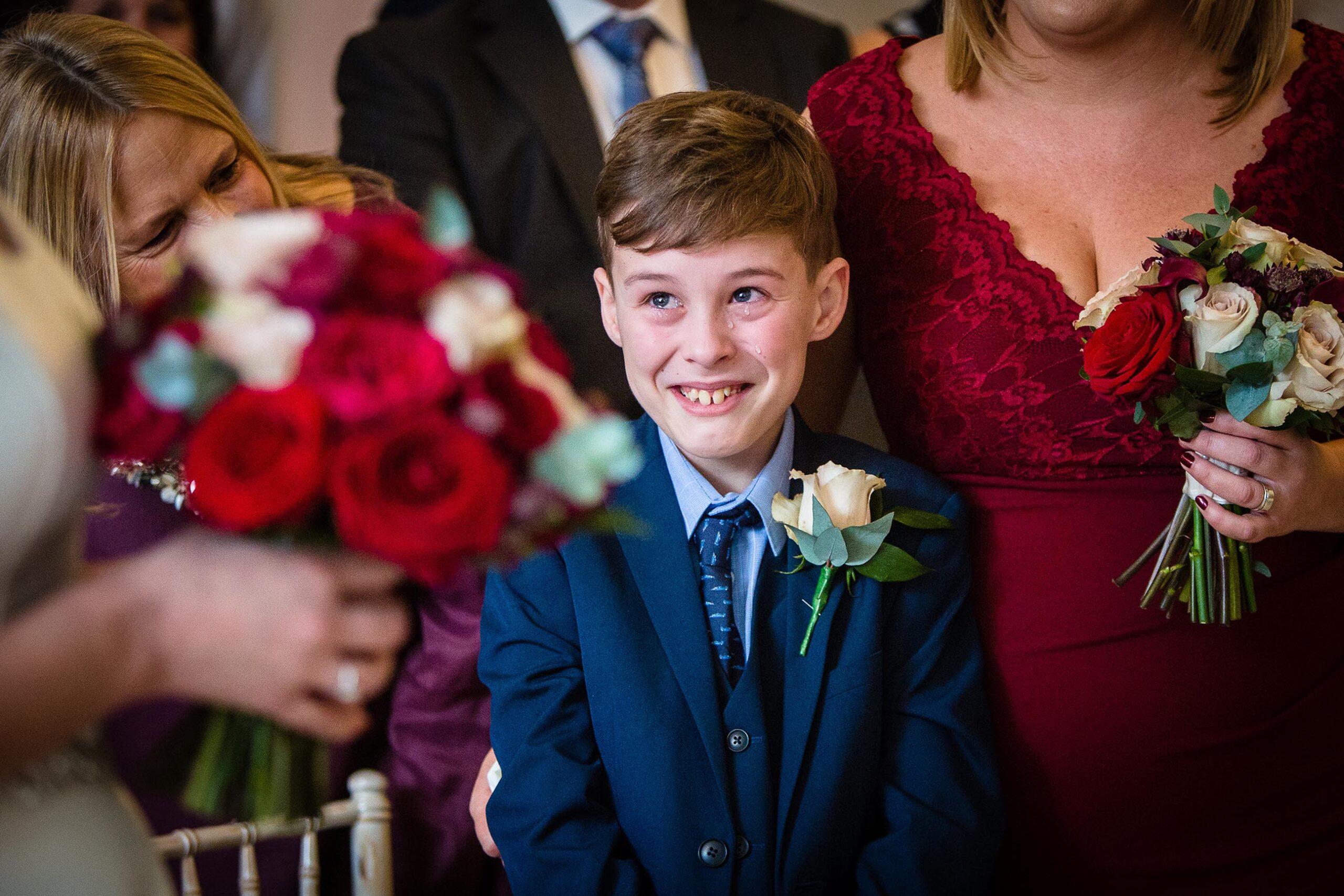 Bride's son crying as he sees his mum come down the aisle to get married at tyn dwr hall, tyn dwr hall wedding photographer
