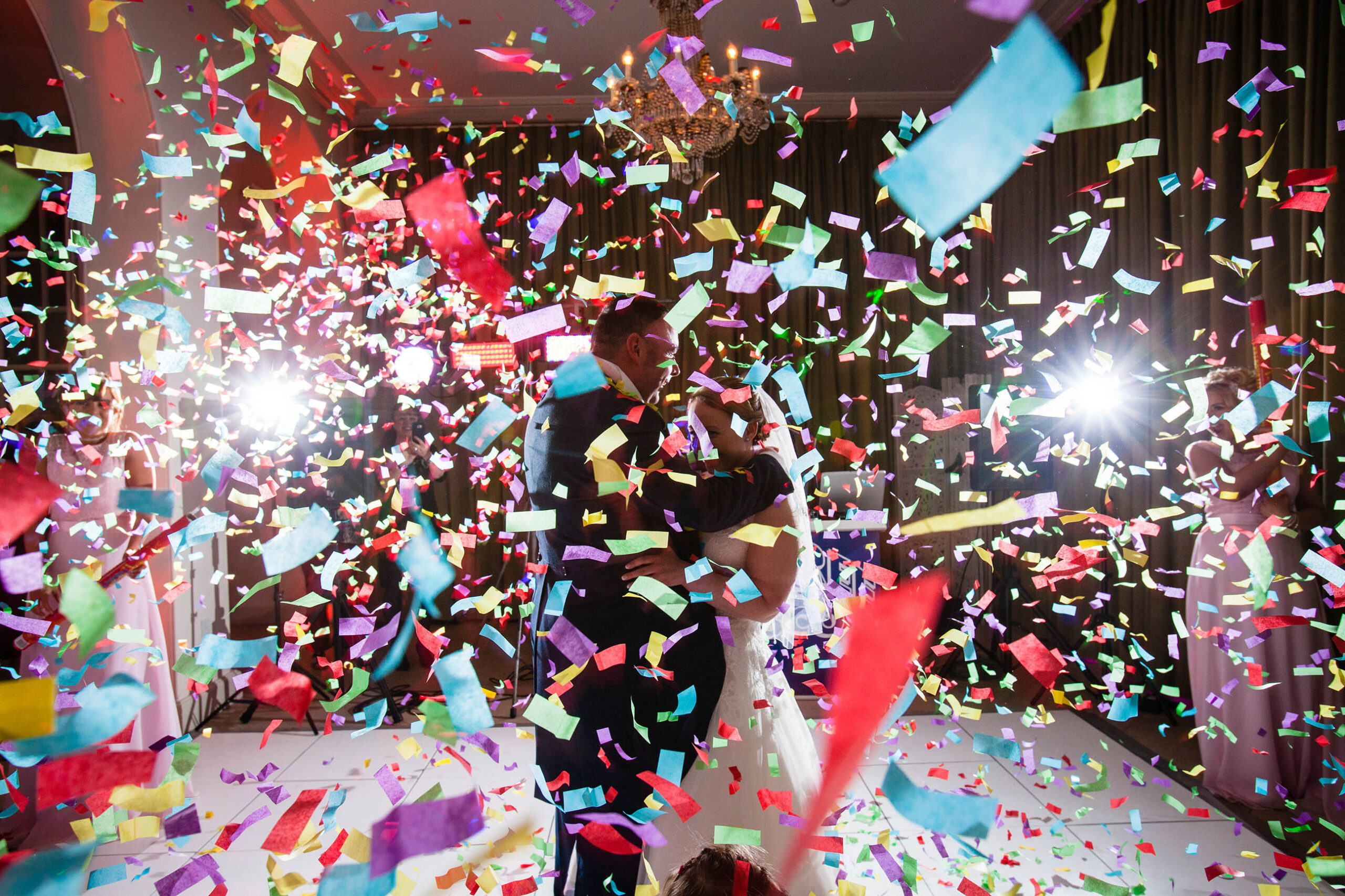confetti canon shower over the bride and groom on the dancefloor at isocyd park, charlotte giddings photography