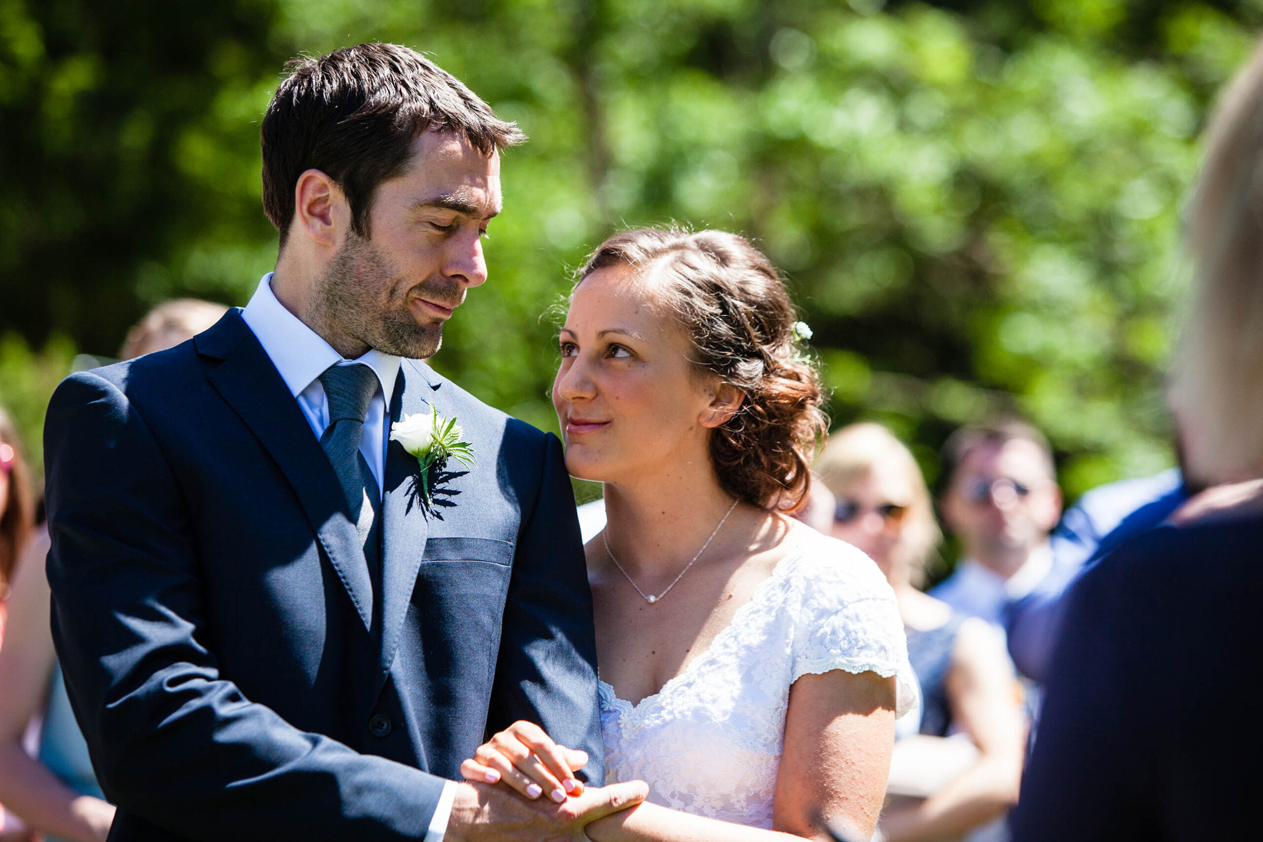 bride and groom looking at each other adoringly at lake montriond, france during ceremony