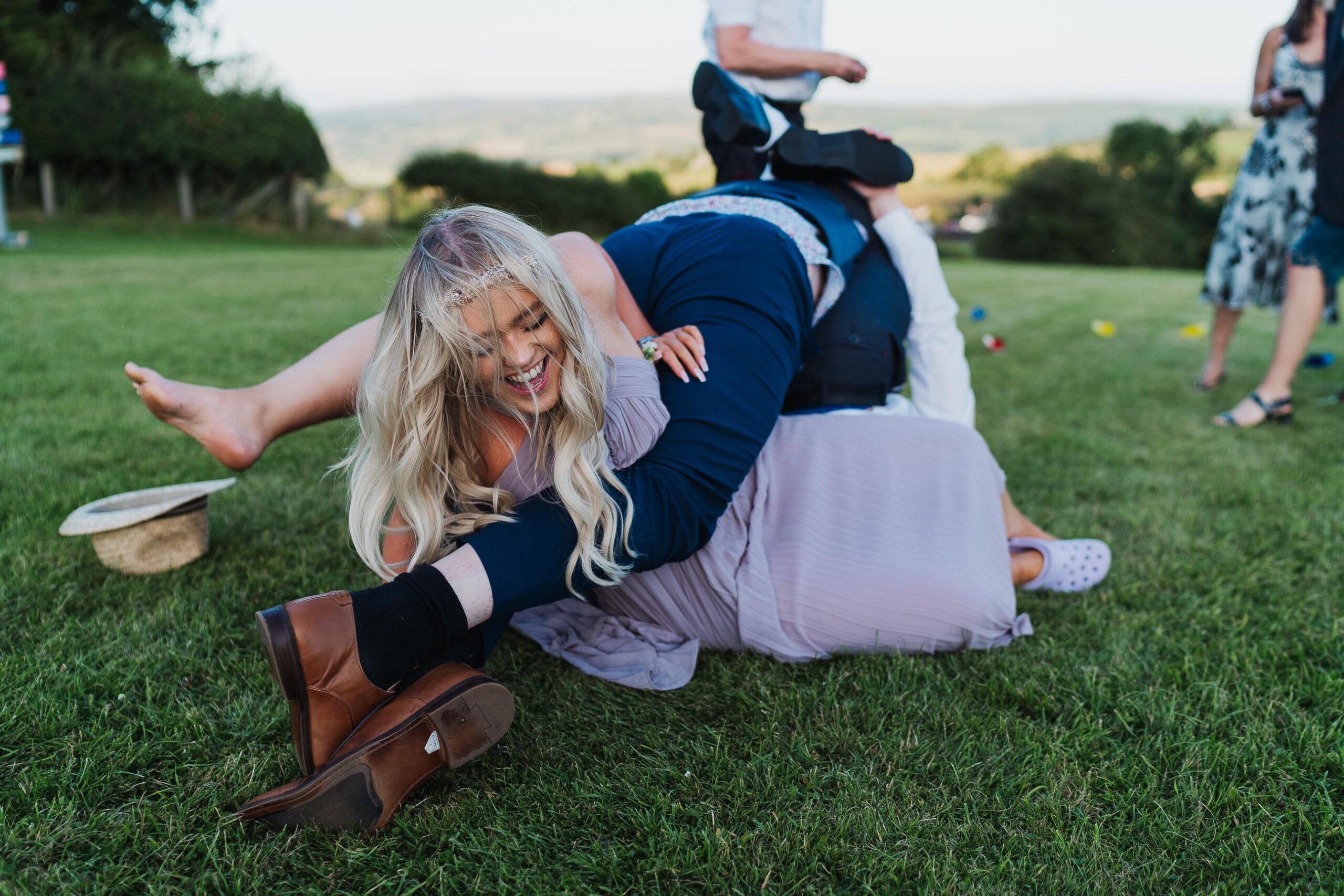 Wedding guests playing village games at marquee wedding in Welshampton, Welsh wedding Photographer