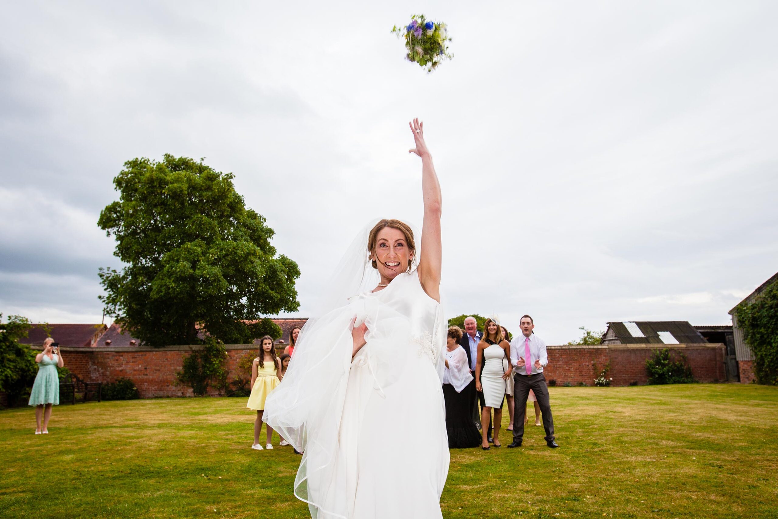 Bride throwing bouquet at Soutlton Hall Wedding 