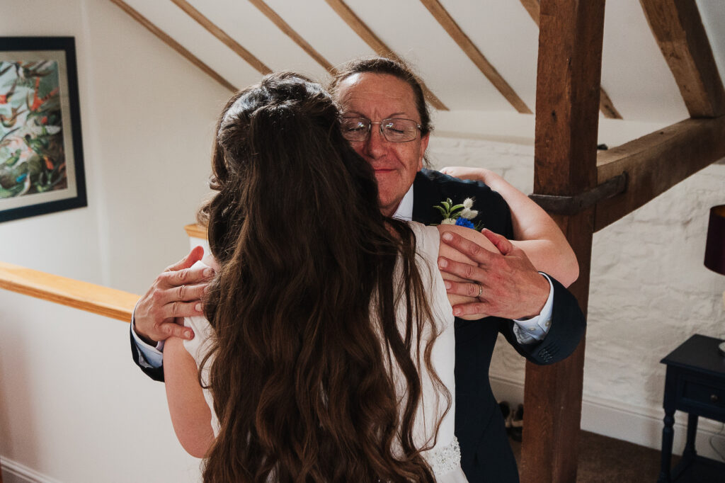 Dad beaming ear to ear as he sees his daughter in her wedding dress for the first time, Shropshire wedding photographer