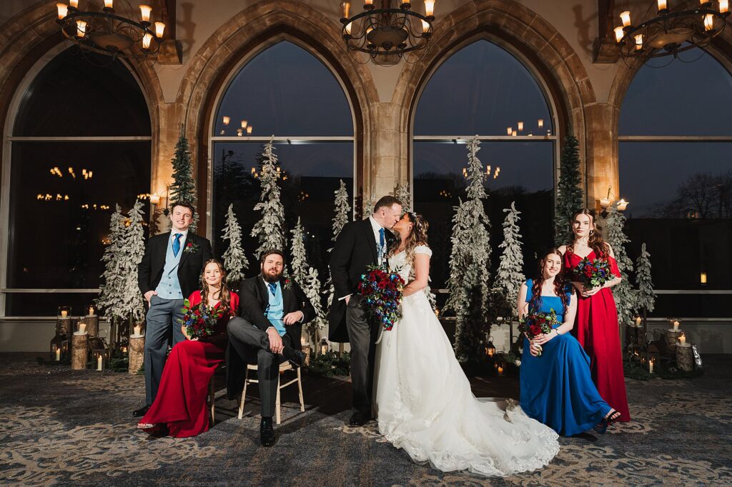 Bride and Groom and the wedding party, Bridesmaids and Best Men, with a winter wonderland backdrop and beautiful large windows