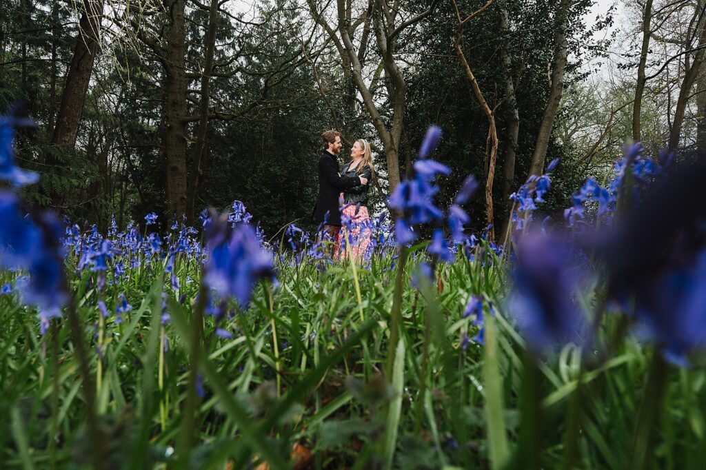 Bride and Groom to be in the bluebells at Combermere Abbey // The bride's favourite flowers