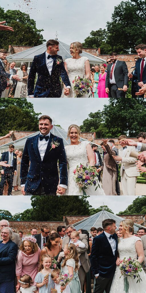 Bride and Groom walking through the confetti tunnel at Combermere Abbey with the stunning Glasshouse as the backdrop, Charlotte Giddings Photographer