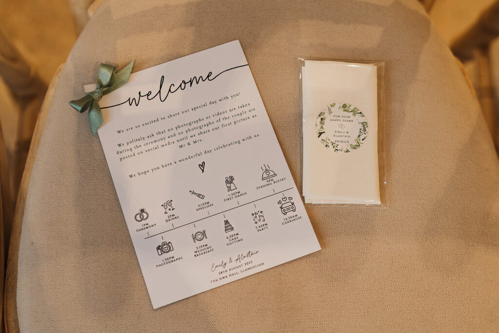 Wedding day itinerary placed on chairs for guests in the wedding ceremony at Tyn Dwr Hall // Wedding Photographer Tyn Dwr Hall