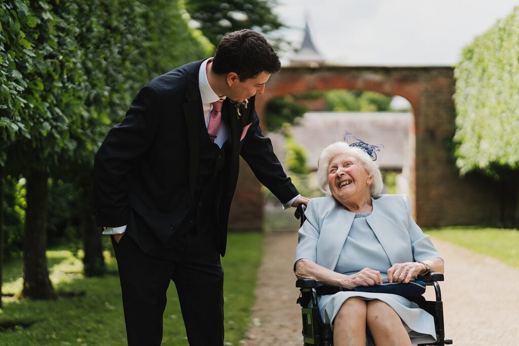 Groom's Nan looking lovingly at her grandson on his wedding day at Combermere Abbey // Combermere Abbey Wedding Photographer