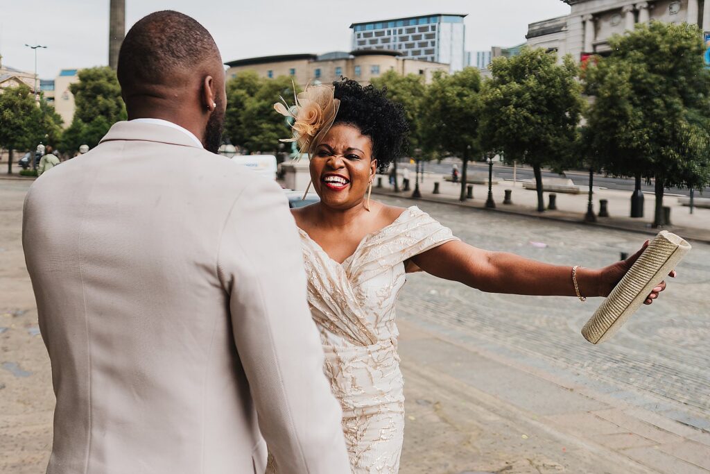 Sister very excited about to give her brother a cuddle outside St. George's Hall before the ceremony // Wedding Photographer Shropshire
