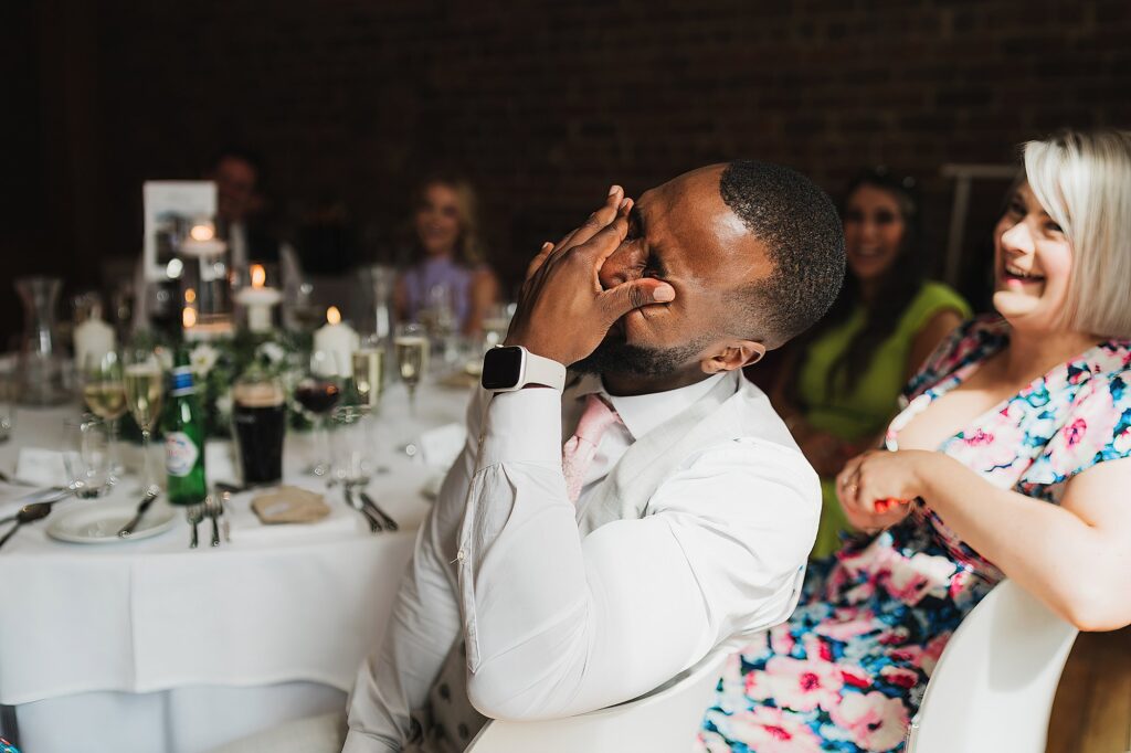 Best Man laughing during the Groom's speech at Liverpool Wedding Venue
