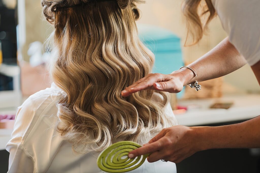Bride having her hair done at Combermere Abbey // Charlotte Giddings Photography