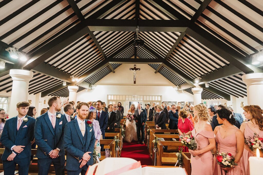 Bride walking down the aisle at St Anne's Church, Nantwich, Cheshire
// Charlotte Giddings Photography