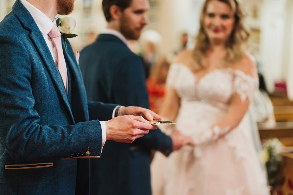 Best man producing the wedding bands in church at St. Anne's Church, Cheshire // Shropshire Wedding Photography