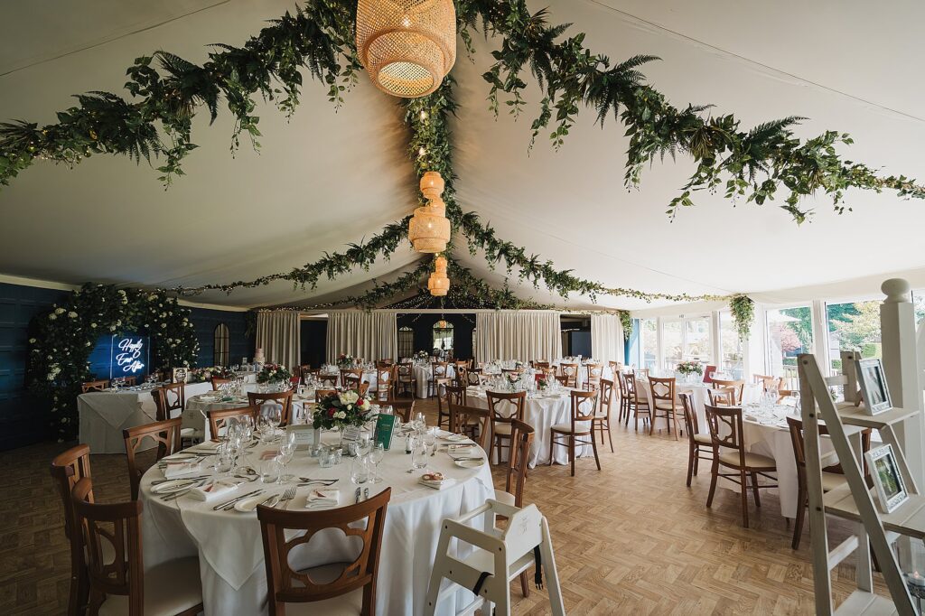 Combermere Abbey Pavilion // Wedding Reception all ready for the wedding guests with neon sign Happily Ever After // Wedding Photography Shropshire