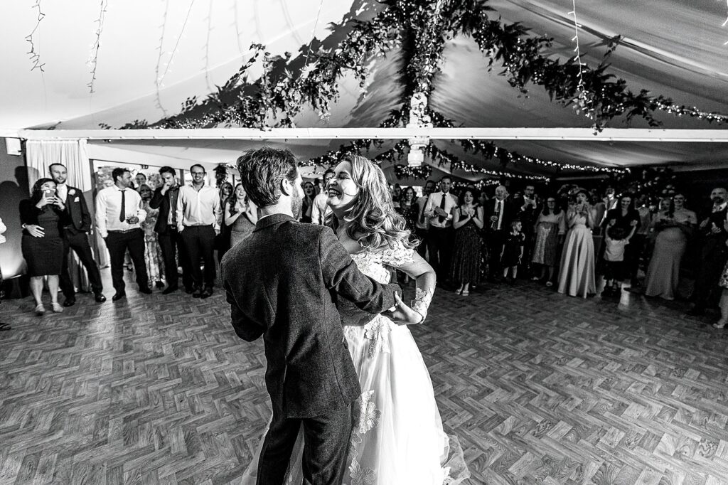 Bride and Groom giggling with each other as they do their first dance at Combermere Abbey // Cheshire Wedding Photography