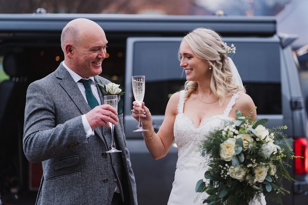 Bride and Father of the Bride having a glass of fizz and having cheers moment before they walk down the aisle together // Charlotte Giddings Photography