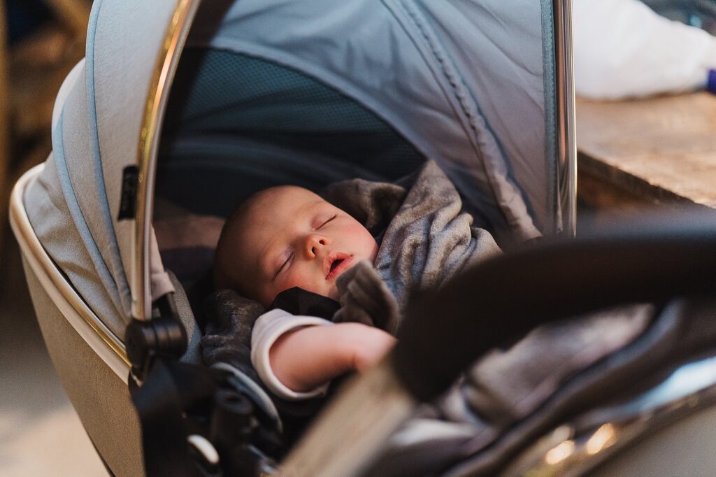 Bride and Groom's newborn baby fast asleep at their Cheshire Wedding Venue // Grange Barn