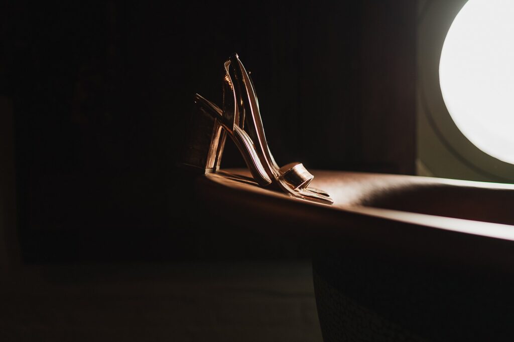 Rose Gold shoes in the sublime sunshine on the copper bath at Grange Barn // Cheshire Wedding Photographer