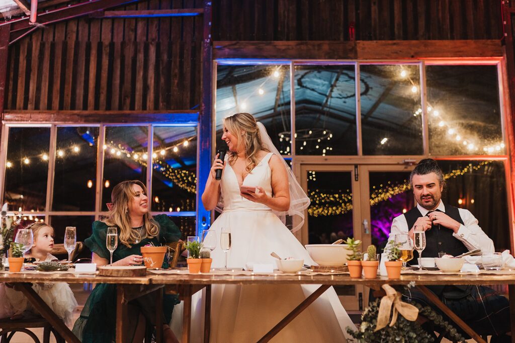 Bride saying her speech at their Grange Barn Wedding , sister looking emotional // Cheshire Wedding Photography
