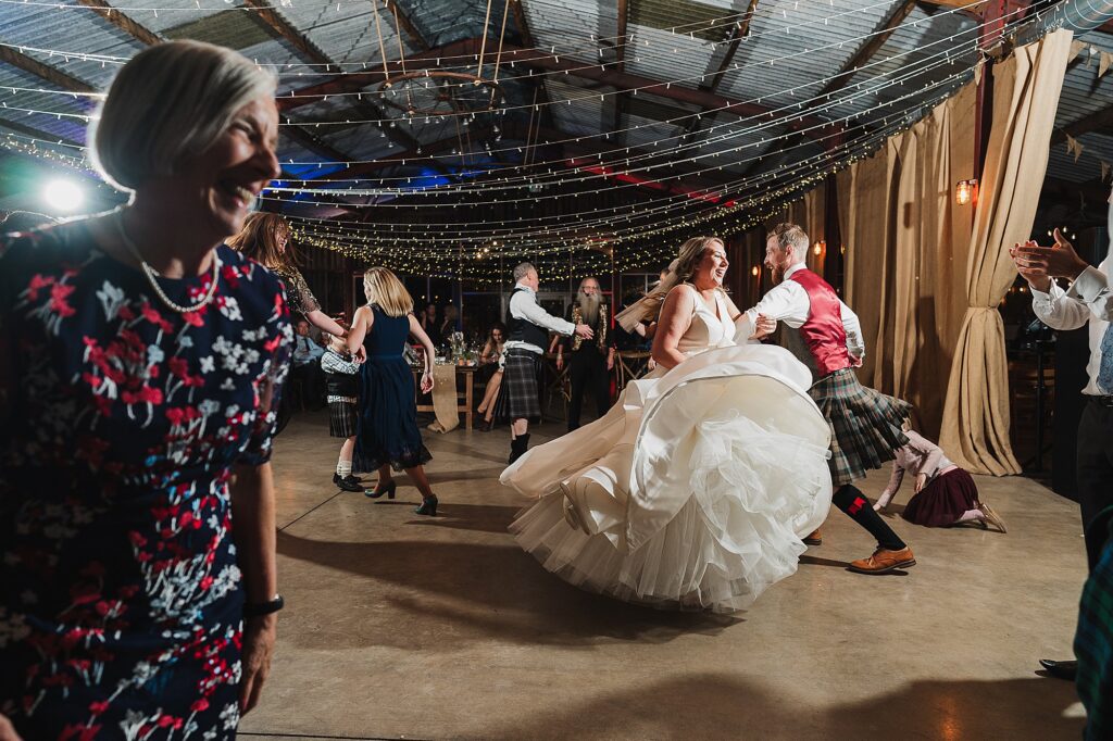 Bride and wedding guests dancing away at the wedding Ceilidh Band // Cheshire Wedding Photographer, Charlotte Giddings Photography
