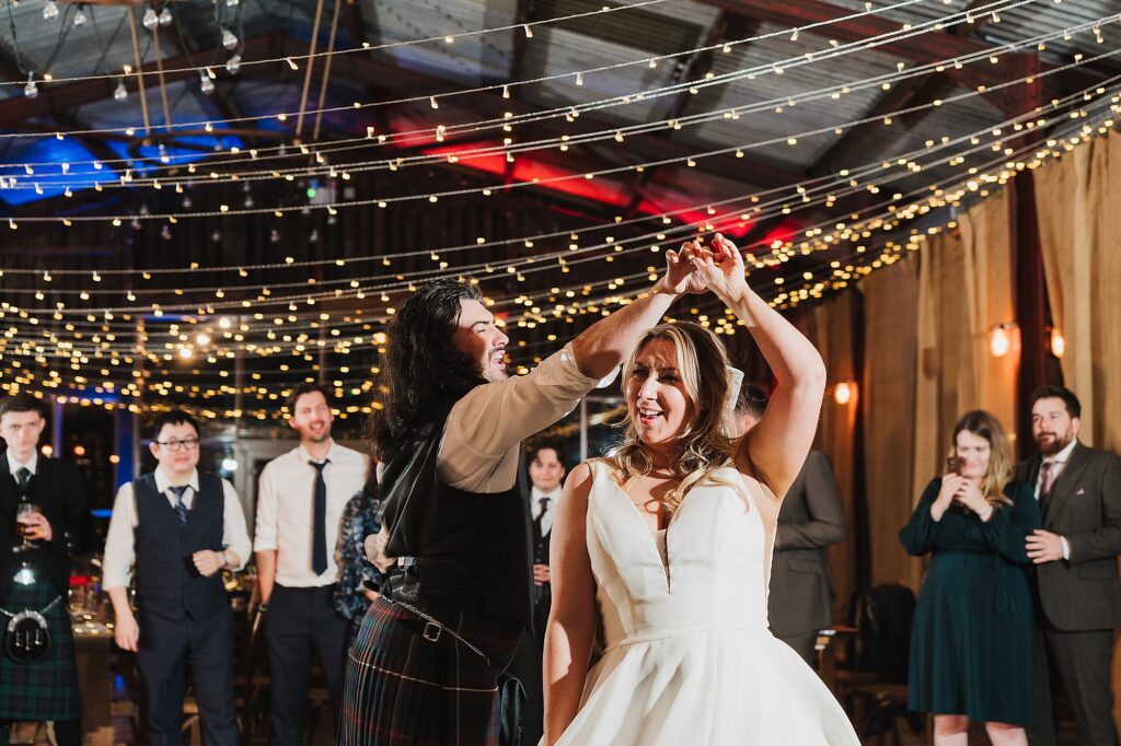 Bride and Groom doing their first dance twirling around at Grange Barn Wedding Barn // Cheshire Wedding Barn // Charlotte Giddings Photographer