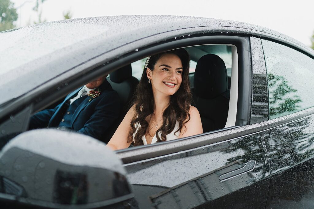 Bride looking so excited as she is about to get out of the car at Hencote Estate // Wedding Photographer Shropshire