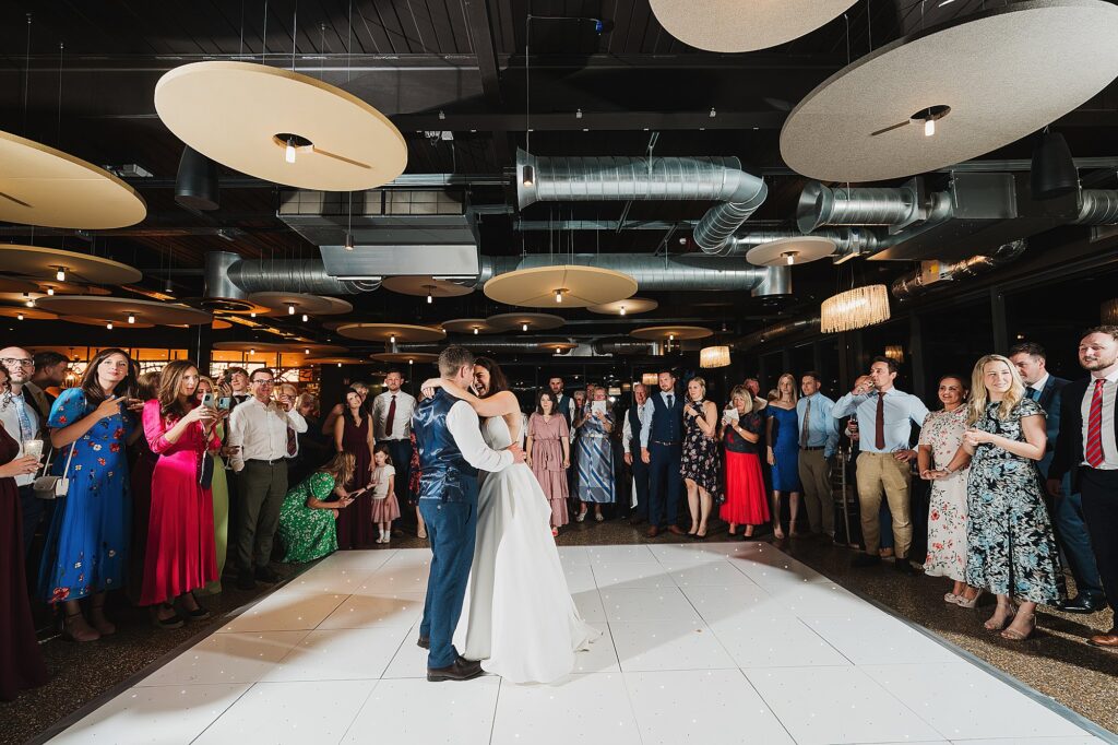 Bride and Groom on the dancefloor as their guests surround them watching at Hencote Estate // Shropshire Wedding Photography