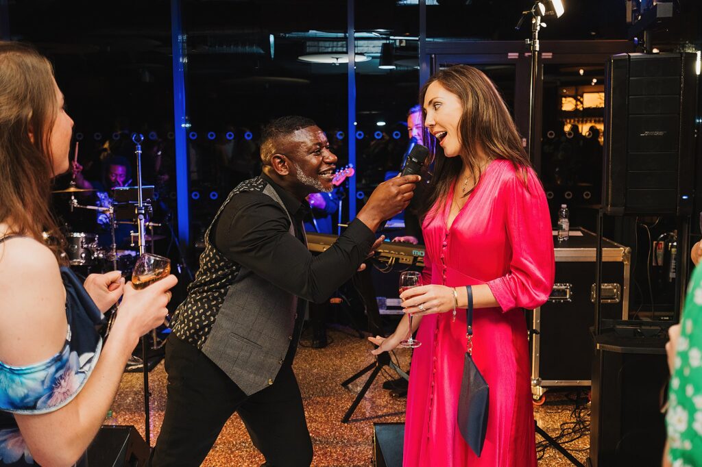 Wedding guests handed a microphone to sing to the guests at Hencote Estate // Wedding Photography Shropshire