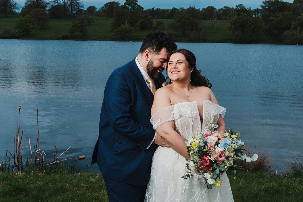 Bride and Groom outside the Abbey at Combermere Abbey Whitchurch, by the lake