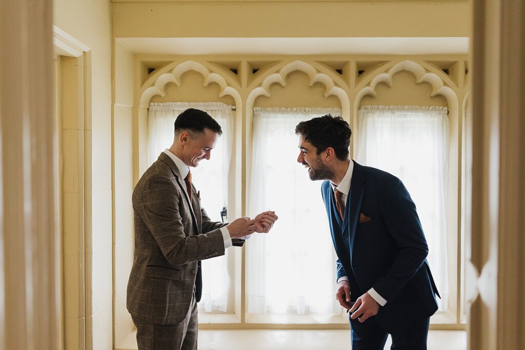 Groom getting ready with his groomsmen in the Stone Lodge, Combermere Abbey Shropshire Wedding Venue