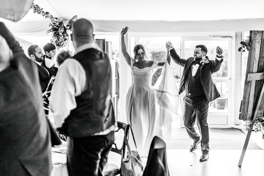 Bride and Groom walking into the Pavilion at Combermere Abbey, Shropshire wedding venue