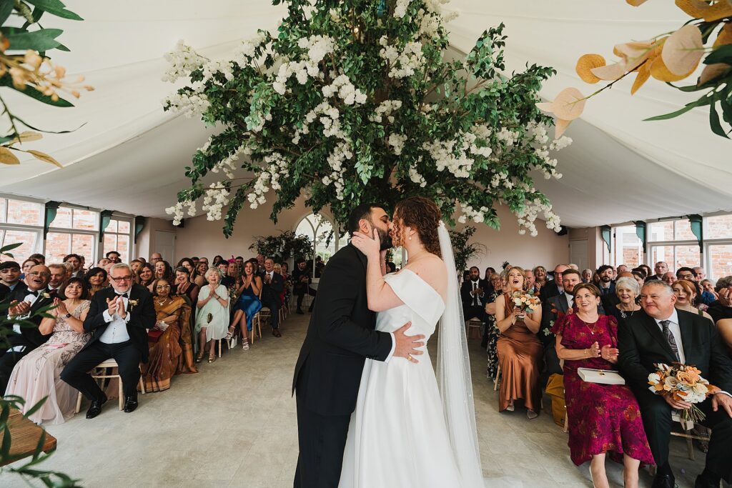 Combermere Abbey wedding ceremony in the Glasshouse