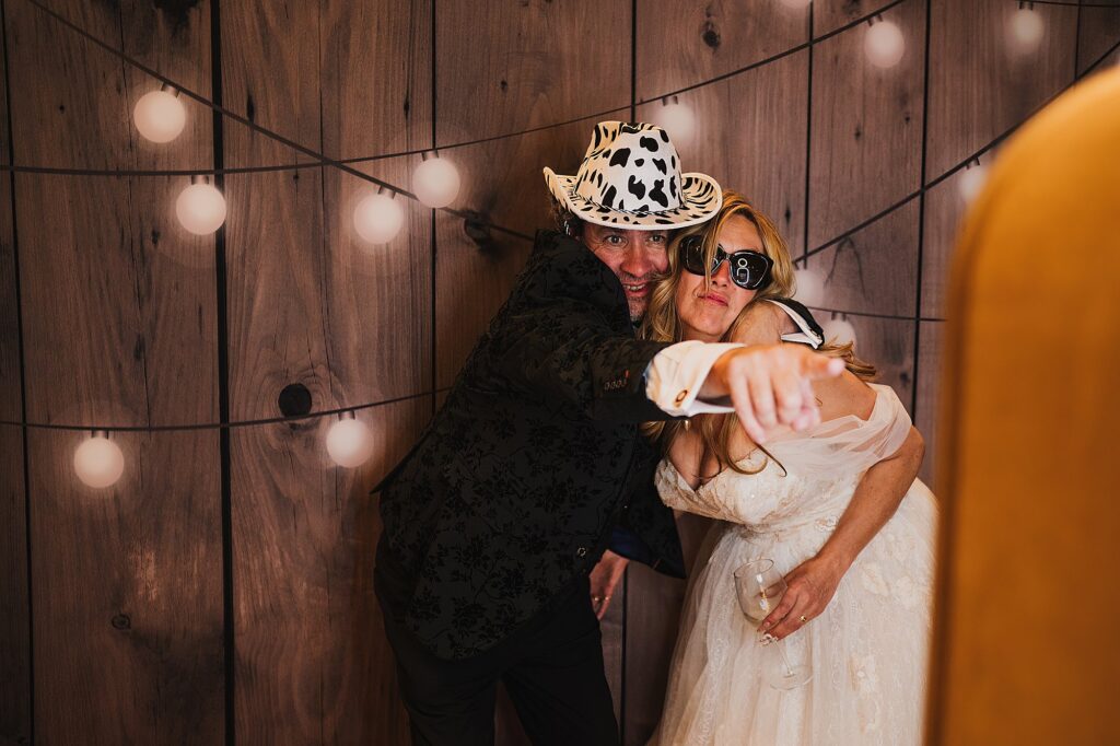 Bride and Groom messing around in the photo booth at their wedding