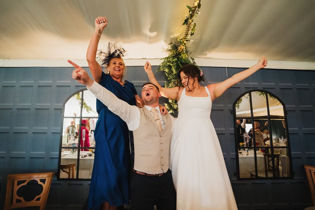 Bride and Groom singing and dancing in the pavillion at Combermere Abbey // Shropshire Wedding Photographer