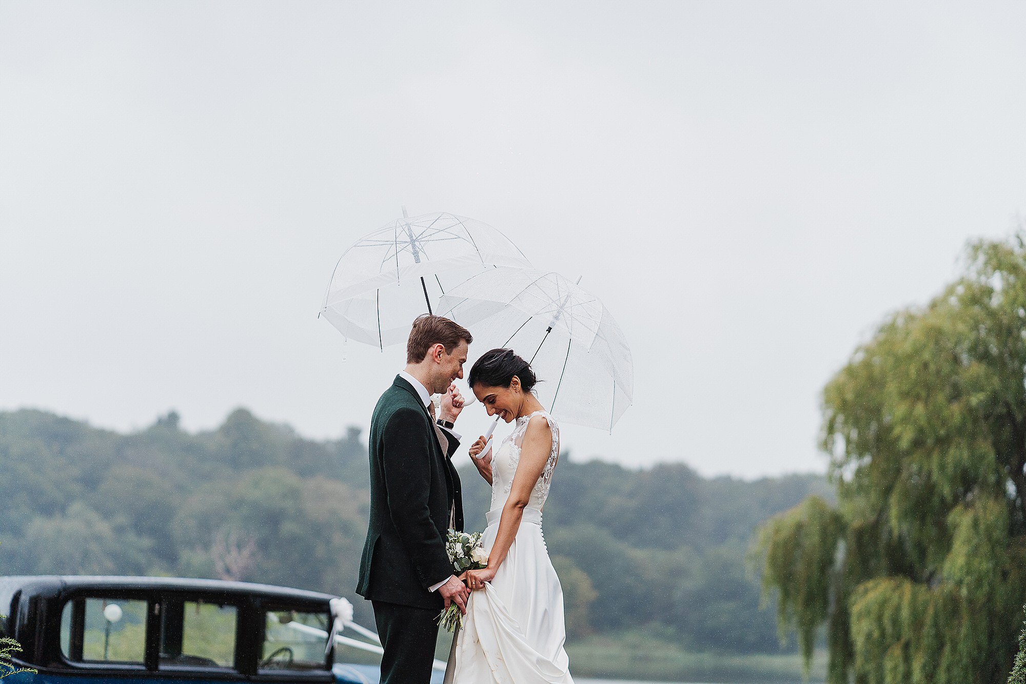 Couple portrait in the rain at Combermere Abbey and Mere